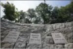  ?? STEPHAN SAVOIA — THE ASSOCIATED PRESS ?? Five women who were hanged as witches 325 years ago at Proctor’s Ledge during the Salem witch trials were remembered yesterday at the site of their death, pictured here, Wednesday in Salem, Mass.