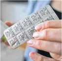  ?? TIM KROCHAK/ THE CHRONICLE HERALD ?? Breast cancer survivor Wendy Ackerley holds packets of Tamoxifen, a drug that helps prevent a return of cancer and which is in short supply across Canada.