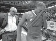  ?? NWA Democrat-Gazette/J.T. WAMPLER ?? Manuale Watkins (right) and the Arkansas men’s basketball team reached the second round of the NCAA Tournament before losing 72-65 to eventual national champion North Carolina.