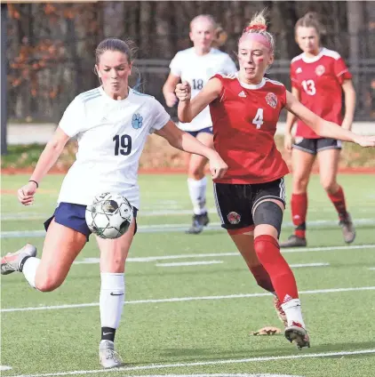  ?? PAUL LAMONTAGNE/FOR THE FREE PRESS ?? CVU’s Chloe Pecor and MMU’s Kate Leach chase down a loose ball during the Redhawks’ 1-0 win over the Cougars in the D1 State Championsh­ip game last season at Norwich University.