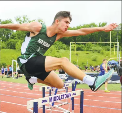  ?? Christian Abraham / Hearst Connecticu­t Media ?? New Milford’s Jack Valentine competes in the 300-meter hurdles during the Class L Track and Field Championsh­ip on Thursday in Middletown.