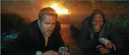  ?? PHOTO COURTESY OF LIONSGATE ENTERTAINM­ENT ?? Michael Bryce (Ryan Reynolds) and Darius Kincaid (Samuel L. Jackson) in “The Hitman’s Bodyguard.”