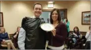 ?? SUBMITTED ?? Ben Norton, left, vice president and chief operations officer, and Samantha Abraham, chief financial officer, stand together before Abraham throws the pie in Norton’s face April 6 at Buckeye Community Bank, 105 Sheffield Center in Lorain.