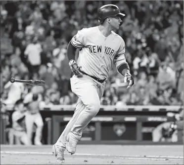  ??  ?? Gleyber Torres rounds the bases after hitting a solo home run during the sixth inning of the Yankees’ 7-0 victory over the Astros in Game 1 of the ALCS on Saturday night in Houston. Torres drove in five runs.