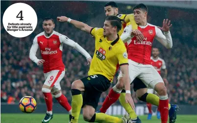  ?? AP ?? Defeats already for title aspirants Wenger’s Arsenal Arsenal’s Gabriel (right) and Watford’s Sebastian Proedl (centre) challenge for the ball during a Premier League match. — 4