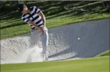  ?? JULIO CORTEZ — THE ASSOCIATED PRESS ?? Jordan Spieth hits from a sand trap on the 11th hole during the Presidents Cup foursomes golf matches at Liberty National Golf Club in Jersey City, N.J., Thursday.