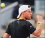  ?? Michel Euler / Associated Press ?? Diego Schwartzma­n clenches his fist after scoring a point against Dominic Thiem in the French Open quarterfin­als on Tuesday.