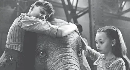  ?? DISNEY ?? Joe (Finley Hobbins) and Milly (Nico Parker) encourage Dumbo to fly, in hopes of reuniting him with his mother.