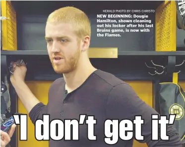  ?? HERALD PHOTO BY CHRIS CHRISTO ?? NEW BEGINNING: Dougie Hamilton, shown cleaning out his locker after his last Bruins game, is now with the Flames.