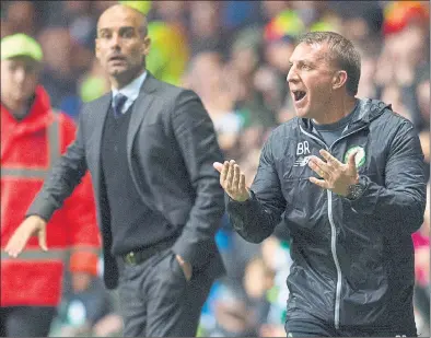  ??  ?? HEAT OF BATTLE: Celtic manager Brendan Rodgers urges his players on from the technical area as Manchester City’s Pep Guardiola looks on.