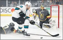  ?? JOHN LOCHER / AP ?? Vegas Golden Knights defenseman Luca Sbisa (47) knocks the puck away from Sharks center Chris Tierney in Game 5 of an NHL hockey second-round playoff game. It was Sbisa’s first game action in weeks for the talent-rich Golden Knights.