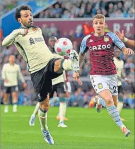  ?? AFP ?? Aston Villa’s Lucas Digne (R) vies with Liverpool’s Mohamed Salah (L) at Villa Park on Tuesday.