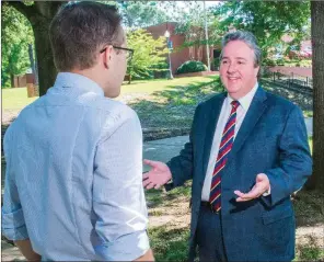  ?? WILLIAM HARVEY/THREE RIVERS EDITION ?? Eric Bork, left, associate vice president for marketing and communicat­ions with Lyon College in Batesville, speaks to Joseph King, the college’s new president, on the school’s campus in Batesville. King became president July 1.