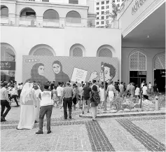  ??  ?? Evacuated guests return to the Movenpick hotel after a small fire broke out. — Reuters photo