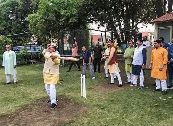  ?? — PTI ?? BJP leader Shivraj Singh Chouhan plays cricket amid Madhya Pradesh political turmoil in Bhopal.