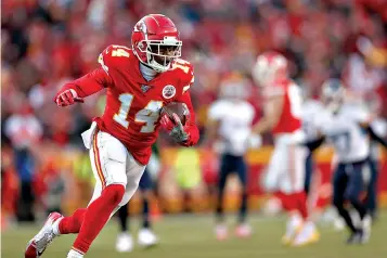  ?? AP Photo/Jeff Roberson ?? ■ Kansas City Chiefs' Sammy Watkins catches a touchdown pass during the second half of the NFL AFC Championsh­ip football game against the Tennessee Titans on Jan. 19 in Kansas City, Mo.