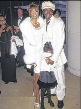  ?? PAUL FENTON / SHOOTING STAR ?? Pop stars Whitney Houston, Bobby Brown attend an event with their daughter, Bobbi Kristina Brown, in 1998.