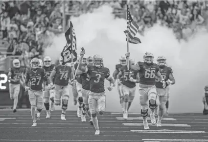  ?? BRIAN LOSNESS/USA TODAY SPORTS ?? The Boise State Broncos bring the American flag onto the field prior to the game against UTEP at Albertsons Stadium on Sept. 10.