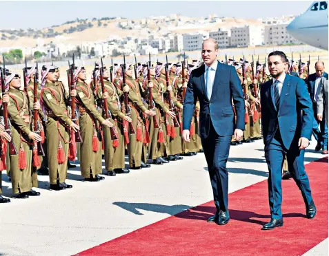  ??  ?? The Duke of Cambridge was greeted by Crown Prince Hussein, the son of Jordan’s King Abdullah II, at the airport in Jordan’s capital, Amman