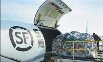  ?? PHOTOS PROVIDED TO CHINA DAILY ?? Goods are loaded onto an airplane of SF Airlines.