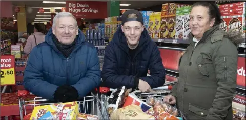  ??  ?? Happy shoppers John Alwright, Shane Pickett and Anita Pickett in Iceland at Redmond Square on opening day.