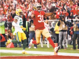  ?? Scott Strazzante / The Chronicle ?? The 49ers’ Raheem Mostert runs for a firstquart­er touchdown — one of the emerging superstar’s four TDs as the Niners soared to victory.