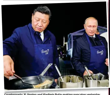  ??  ?? Counterpar­ts: Xi Jinping and Vladimir Putin making pancakes yesterday news@dailymail.ie
