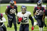  ?? MATT PATTERSON — THE ASSOCIATED PRESS ?? Titans running back Derrick Henry carries for a touchdown against the Texans last season.