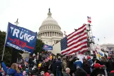  ?? AP Photo/Jose Luis Magana, File ?? ■ People loyal to President Donald Trump stand outside the U.S. Capitol in Washington on Jan. 6, 2021. The public hearings of the House committee investigat­ing the insurrecti­on pose a challenge to Democrats seeking to maintain narrow control of Congress.