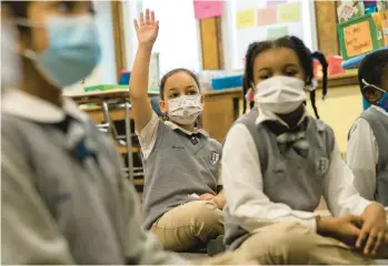  ?? CHRISTOPHE­R CAPOZZIELL­O/THE NEW YORK TIMES ?? A study reveals a link between mask mandates and COVID-19 in schools.