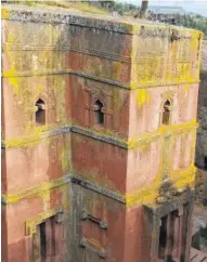  ?? MARCUS ELIASON VIA THE ASSOCIATED PRESS ?? Above is one of the 12th century churches carved from stone in Lalibela, Ethiopia. The architectu­ral marvels are one of the country’s most magical attraction­s. At right. religious art decorates the interior of a circular, thatch-roofed church on an...