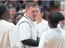  ?? ADAM CAIRNS/ COLUMBUS DISPATCH ?? Pickeringt­on Central coach Chris Wallace talks to his team during the Division I regional final March 8.