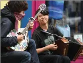  ??  ?? It wasn’t just the Munster folk laying into it with gusto at the Fleadh, as trad talents Leo Mantsuoka and Kanako Machida from the province of Japan attested inafine performanc­e on-street.