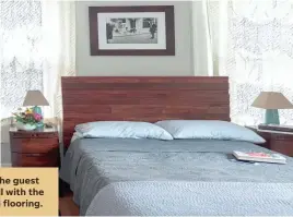  ??  ?? The furniture in the guest bedroom goes well with the original hardwood flooring.
