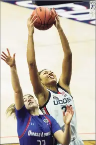  ?? David Butler II / USA TODAY / Contribute­d Photo ?? UConn’s Olivia Nelson-Ododa (20) grabs a rebound over UMass Lowell’s Tiahna Sears (33) on Saturday.