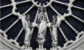  ?? Photograph: Benoît Tessier/Reuters ?? A view shows statues of the western rose window of Notre-Dame Cathedral.