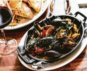  ?? Photos by Kirsten Gilliam ?? The Nash serves mussels with Spanish chorizo, chardonnay, blistered tomatoes and herb butter. The American restaurant and bar is downtown at 1111 Rusk.