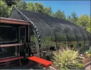  ?? PHOTO COURTESY CORNELL COOPERATIV­E EXTENSION OF ONEIDA COUNTY ?? The Butterfly House at the Parker F. Scripture Botanical Gardens in Oriskany.