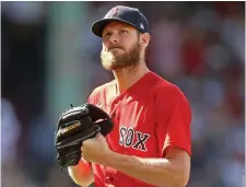  ?? MATT STONE PHOTOS / HERALD STAFF FILE ?? STILL SPREADING: Red Sox manager Alex Cora, top, is trying to stay upbeat as the team’s coronaviru­s outbreak keeps getting worse, now with ace pitcher Chris Sale, above, testing positive. In total, 13 players have been placed on the COVID list in the last 14 days.