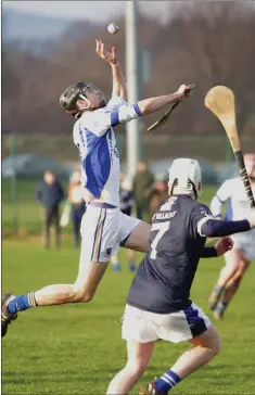  ??  ?? Wicklow’s Andrew Kavanagh gathers possession ahead of Graham Proctor of IT Tallaght.