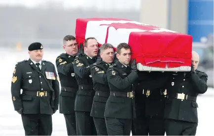  ?? PETER J. THOMPSON FILES ?? The body of Sgt. Kirk Taylor is taken to a hearse during a repatriati­on ceremony at CFB Trenton, Ont., in January 2010. Taylor, Sgt. George Miok, Pte. Garrett Chidley, Cpl. Zachery McCormack and Calgary Herald journalist Michelle Lang were killed in an improvised explosive device blast in Afghanista­n. Ben Rowswell was Canada’s representa­tive in Kandahar at the time.