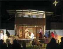  ?? THE ASSOCIATED PRESS ?? Members of the Second Baptist Church take part in the 62nd annual live nativity outside of the church Friday in Odessa, Texas.