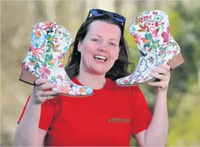  ??  ?? These boots are made for walking Denise Eccles took part in her own‘Darkness Into Light’walk