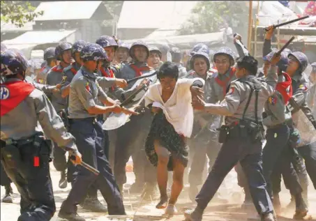  ??  ?? Police hitting a student protester during a violent protest in Letpadan, Myanmar…yesterday