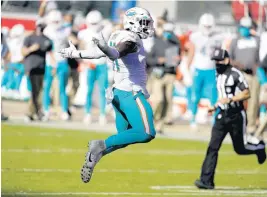  ?? TONYAVELAR/AP ?? Dolphins defensive end Emmanuel Ogbah celebrates during the second half against the 49ers in SantaClara, Calif., on Sunday.