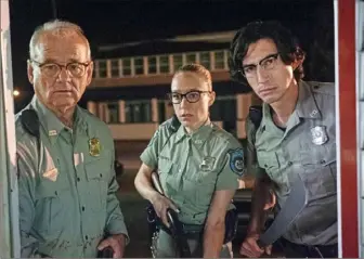  ?? Abbot Genser/Focus Features/Image Eleven Production­s Inc. ?? Bill Murray, left, Chloe Sevigny and Adam Driver realize something very strange is going on in town in “The Dead Don’t Die.”