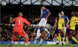  ??  ?? Mason Holgate scores Everton’s opener and his first goal for the club in the fourth-round League Cup tie against Watford. Photograph: Craig Brough/Action Images via Reuters