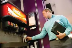  ?? SAMMY JO HESTER/THE DAILY HERALD/AP ?? Greg Bird fills his cup with Coca Cola on campus at Brigham Young University on Thursday.