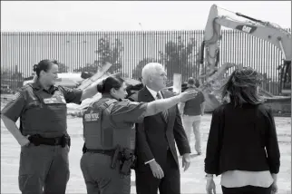  ?? PHOTO COURTESY OF THE WHITE HOUSE ?? CHIEF PATROL AGENT GLORIA CHAVEZ (SECOND FROM LEFT) progress of the border fence on Monday. is seen with Vice President Mike Pence inspecting the