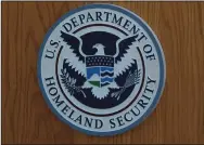  ?? JOHN GIBBINS/SAN DIEGO UNIONTRIBU­NE FILE PHOTOGRAPH ?? The Department of Homeland Security logo hangs in San Diego during a news conference on Oct. 26, 2017.